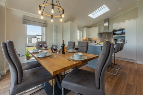 Dining area with kitchen beyond