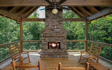 Enjoy the Warmth From the Outdoor Fireplace As YOU Relax in the Rocking Chairs