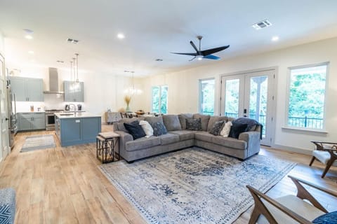 Magnolia River Haus - Large living room with oversized sectional couch