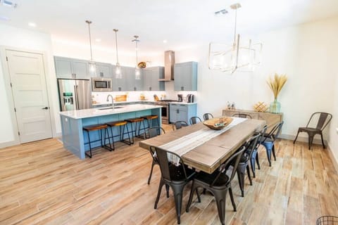 Dining room and island with bar seating