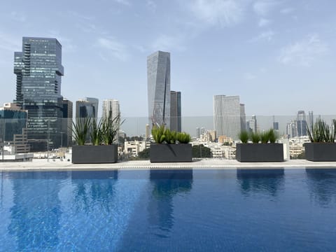 Outdoor pool, open 10:00 AM to 5:30 PM, pool umbrellas, sun loungers