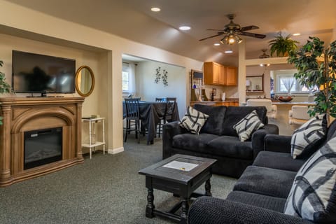Gather by the fireplace with the TV above