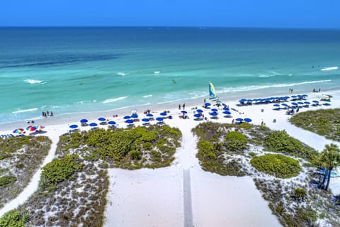 Siesta Sands private beach on Siesta Key.  Blue umbrellas for rent.  It's here for you!