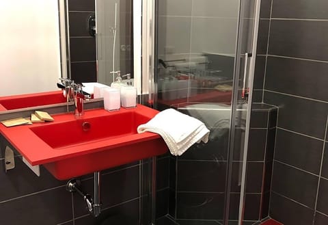 Shower, rainfall showerhead, bidet, towels