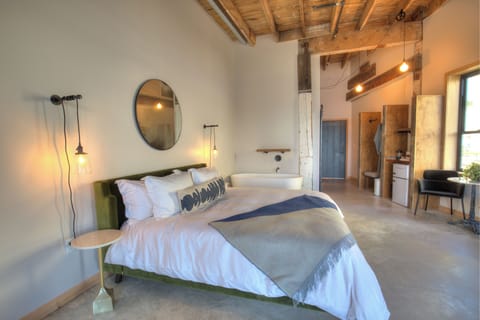 Buoy Suite | Frette Italian sheets, premium bedding, desk, blackout drapes