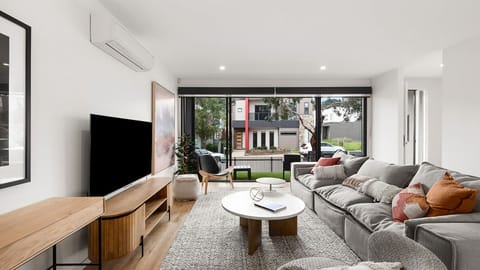 Anchorage Villa Living Room opening to al fresco