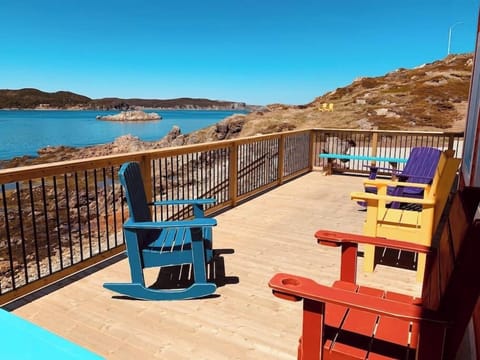Sit on this ocean-front deck and observe the locals coming and going in the harbour, while gazing out to sea where you might just spot a breaching humpback or a passing iceberg.