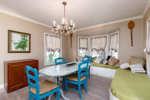 Dining room with bay window lounging / sleeping berths with stowaway cupboards
