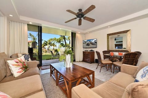 Gather in sunlit living spaces that open to palms and sky.