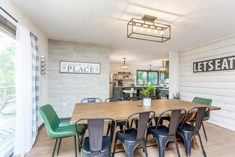 Gather and dine in style in this spacious dining area, featuring seating for eight. Perfectly positioned in an open-concept layout, the dining area flows seamlessly into both the kitchen and living room, making it an ideal space for entertaining or f