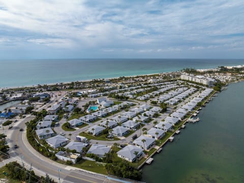Aerial View of Community located across from Public Beach. 