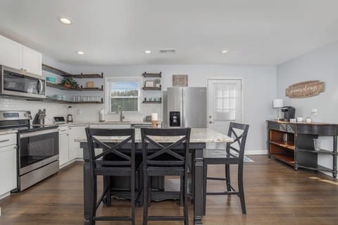 Granite countertops in the main kitchen area and the island provide you with plenty of space to bring all your ideas to the table.