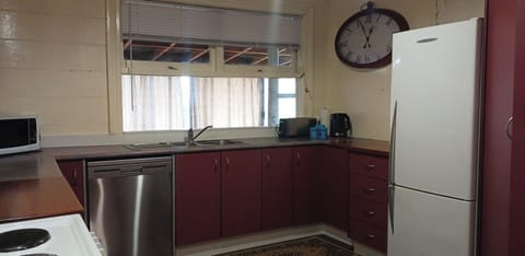 Roomy kitchen with fridge-freezer, stove, dishwasher & microwave