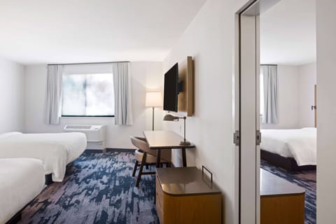 Desk, laptop workspace, iron/ironing board, free cribs/infant beds