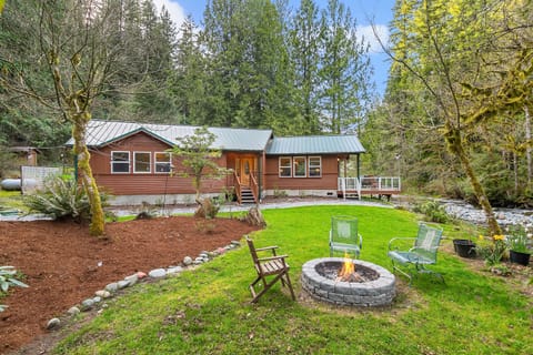 Front yard fire pit next to creak.