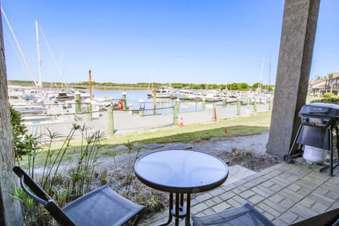 Bohicket Marina Condo has a covered patio that overlooks the Bohicket River and Marina.