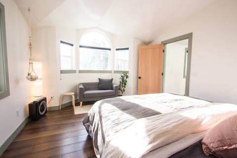 Warm and airy master bedroom with private bath entrance. 
