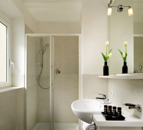 Shower, free toiletries, hair dryer, towels