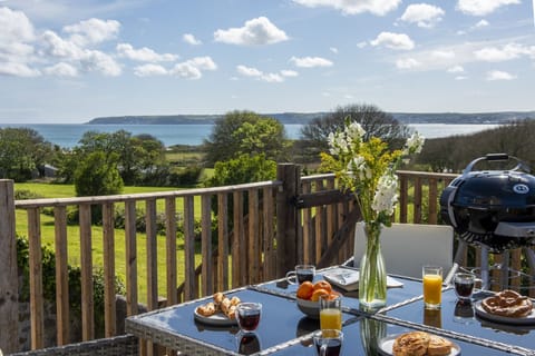 Balcony over looking the garden and sea - Greenfields Coach House