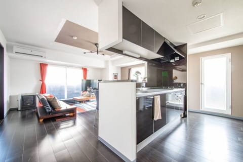 Apartment, Non Smoking | Living area | Flat-screen TV