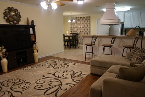 TV with view of Dining Room and Kitchen
