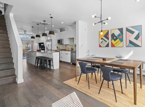 Bright East Austin dining nook for tacos, board games, or laptop time. Big windows, bold art, and plenty of space to gather.