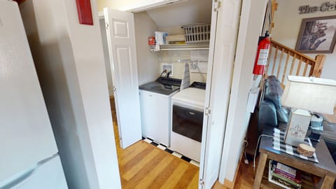 New full-size washer/dryer with detergent, dryer sheets, iron and board.