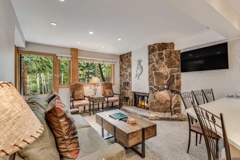 Living room with wood-burning fireplace