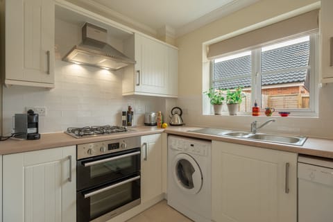 Ground floor: Well-equipped kitchen with gas cooker, fridge-freezer, dishwasher, washer-dryer and Nespresso coffee machine