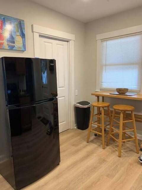 A shot of the breakfast bar and fridge