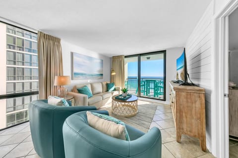 Unwind in a serene coastal living space where soft hues and sweeping ocean views create effortless elegance.