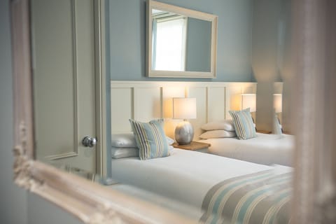 Desk, iron/ironing board, cribs/infant beds, rollaway beds