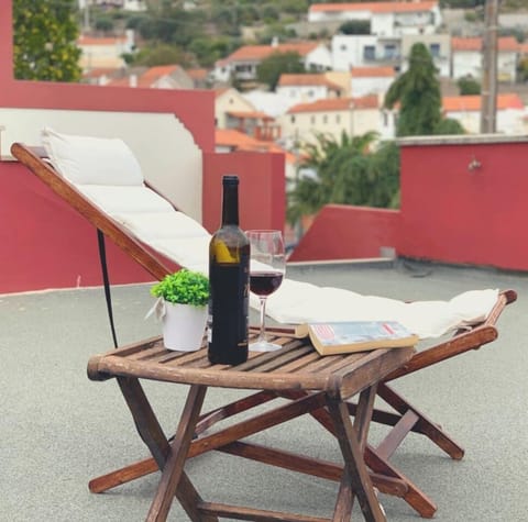 Relax With A Glass Of Wine on our roof top patio