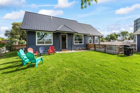 View of the yard and entrance to the home. 
