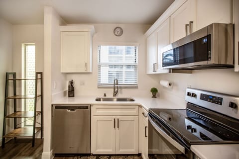 New-0-901-Beach-Road,-Unit-206,-Kitchen-Toward-Window-and-Entry.jpg