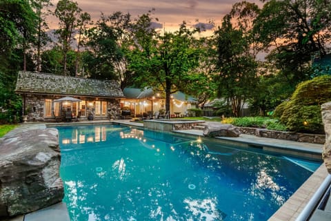 Nestled among lush landscaping, the stunning private pool is the perfect retreat for relaxation and fun.