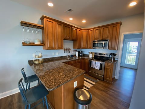 Our kitchen is well stocked with plenty of dishes and utensils!