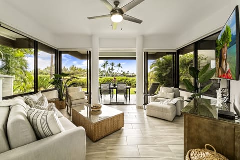 Living Room with Sofas, Smart TV, and Ceiling Fan
