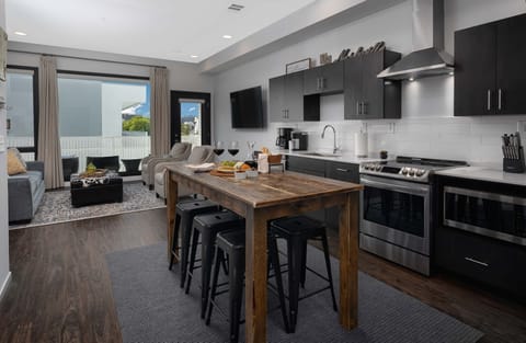 Fully stocked kitchen with stainless steel appliances and plenty of seating
