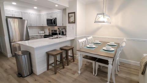 High end finishes including granite countertops and stainless appliances.
