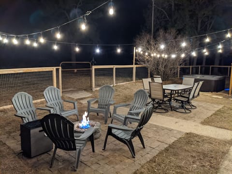 Backyard firepit, picnic table, and hot tub