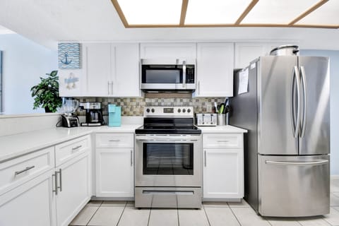 Kitchen open to the dining and living area.Full sized Mr Coffee type and Keurig.