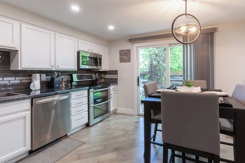 Dining space opens to fresh air and backyard light. Leads to private back patio