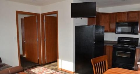 Executive Suite | Private kitchen | Fridge, microwave, stovetop, coffee/tea maker