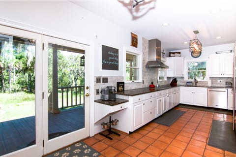 Fully equipped kitchen with exceptional counter space, stainless steel appliances, Keriug coffee maker with built-in frother, Wolf electric range, and a Sub Zero fridge.