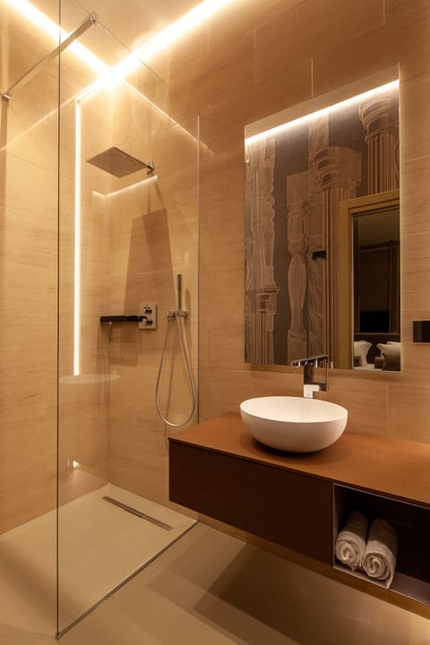 Family Room | Bathroom | Rainfall showerhead, slippers, bidet, towels