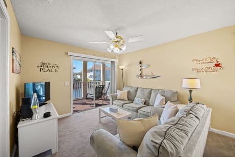 Enjoy the lake view from the living room at Tilghman Shores 