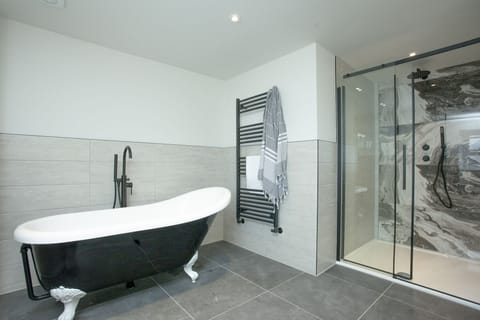 Freestanding bath with heated towel rail and walk in shower - Pilgrim Suite