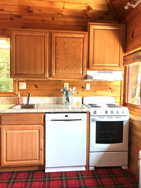 Kitchen has all the appliances, pans and utensils that you need to cook meals.