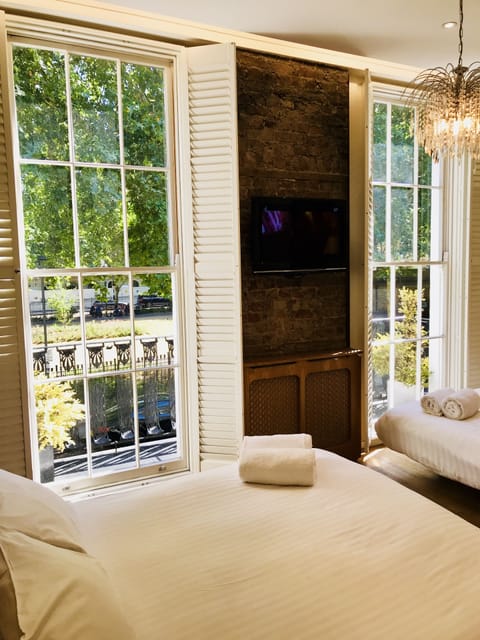 Family Suite, Ensuite, Garden View | Laptop workspace, blackout drapes, iron/ironing board, free WiFi